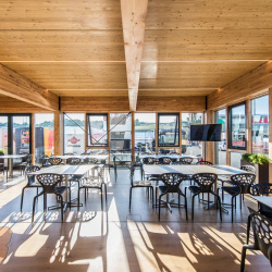 <p>Red Bull have launched their brand new Energy Station that will accompany the MotoGP World Championship around Europe. The wooden 'Holzhaus' is set over three levels, encompassing stunning design, engineering, architecture but moreover, a warm welcome that continues Red Bull's open house policy that has been so successful in the F1 Paddock.
	<br>
	<br>Photos courtesy of<span>&nbsp;</span><strong>Red Bull KTM Factory Racing</strong></p>